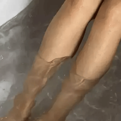 both feet soaking in water